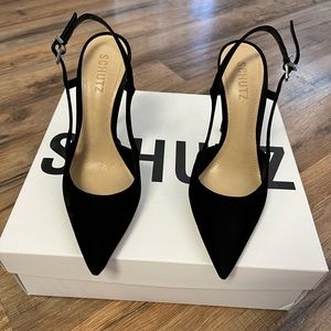 Schutz black suede pumps.